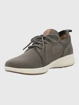 Zapatillas grises Hush Puppies modelo Spinal Knit con capellada de cuero y tejido de punto, cordones y suela blanca.