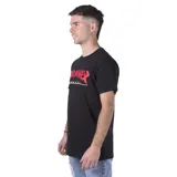 Remera negra de manga corta con estampado frontal del logo de Thrasher con la imagen de Godzilla.