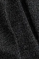 Pantalón negro de punto bouclé con cintura elástica y piernas rectas.