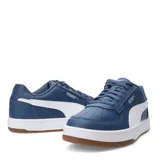 Championes urbanos Puma Caven 2.0, color blanco con detalles en verde y suela color caramelo.