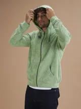 Campera con capucha de toalla de algodón color verde azulado, con cierre frontal y bolsillos laterales.