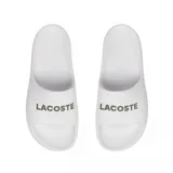 Ojotas Lacoste Serve Slide 2.0 blancas con logo Lacoste en verde.