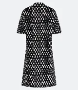 Vestido corto de algodón con estampado geométrico en blanco y negro, cuello redondo y mangas cortas con recortes en contraste.