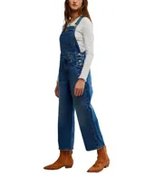 Enterito de jean azul con peto frontal, tirantes ajustables y botones laterales. Tiene bolsillos en el peto, laterales y traseros.