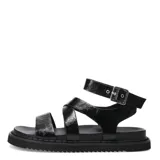Sandalias plateadas con tiras cruzadas y hebilla al tobillo. Plataforma plana con suela de goma negra.