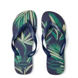 Sandalias Havaianas modelo Aloha, color azul marino con estampado de hojas de palmera en tonos verde y beige.