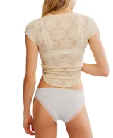 Bombacha de bikini negra con detalles de encaje color crema.