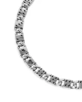 Collar plateado de eslabones con dijes de tréboles, corazones, diamantes y estrellas.