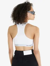 Top deportivo blanco con espalda racerback y banda elástica con logo Carhartt en jacquard.