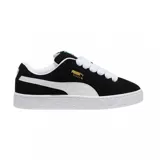 Championes Puma Suede XL color lila con detalles en blanco y suela color caramelo.