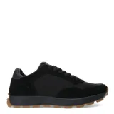 Zapatillas deportivas negras con detalles en gamuza y suela marrón.
