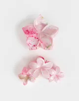 Set de dos broches para el pelo con forma de flor hawaiana, de color rosa con detalles en blanco y verde.