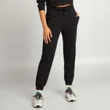 Pantalón de jogging negro, con corte ajustado y tiro medio, ideal para looks casuales.