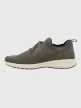 Zapatillas grises Hush Puppies modelo Spinal Knit con capellada de cuero y tejido de punto, cordones y suela blanca.