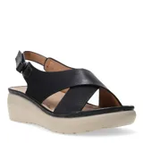 Sandalias negras con tiras cruzadas y plataforma beige.