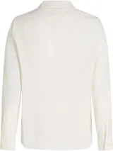 Camisa de manga larga color blanco hueso, de pana de algodón, con cuello clásico, cierre frontal con botones y logo de Tommy Hilfiger bordado en el puño.