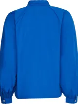 Camisa azul de algodón orgánico, corte amplio y mangas raglán.