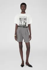 Camiseta blanca de cuello redondo con estampado de palmeras y la inscripción 'BING' y 'LOS ANGELES'.
