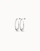 Aros ovalados irregulares bañados en plata, elaborados artesanalmente en España.