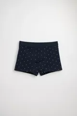 Boxer corto de algodón azul marino con estampado de anclas blancas. Tiene cintura elástica.