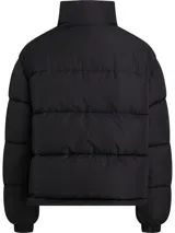 Campera reversible de poliéster impermeable color borgoña con logo Calvin Klein Jeans estampado en blanco. Un lado es liso y el otro tiene un diseño con monogramas.