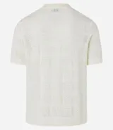 Remera polo de manga corta color beige, con cuello inglés y textura patchwork en cuadrados.