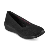 Zapato plano Skechers Arya For Real, color negro, con capellada tejida, plantilla acolchada Skechers Air-Cooled Memory Foam y suela de tracción flexible.
