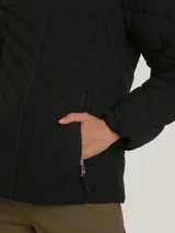 Campera acolchada negra de Tommy Hilfiger con cuello alto forrado en piel sintética, cierre de cremallera, bolsillos laterales y detalles distintivos de la marca.