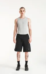 Musculosa básica unisex color gris melange, confeccionada en tela morley con moldería slim-fit.