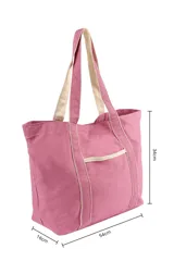 Bolso tipo tote marrón con detalles en color crema en las asas, los bordes y el bolsillo frontal.