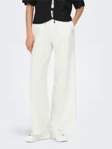 Pantalón ancho de lino y viscosa color blanco, con cintura elástica y cordón ajustable.