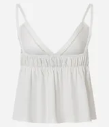 Blusa blanca de algodón y poliéster con breteles finos, escote en V con lazo ajustable y detalles de recortes decorativos.