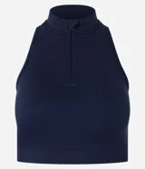 Top deportivo negro con cuello alto, escote halterneck y media cremallera. Confeccionado en poliamida seamless sin copa.