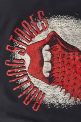 Remera negra de algodón de corte amplio con estampado del logo de la banda The Rolling Stones y la leyenda "Tour 1994".