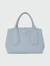 Bolso Longchamp modelo Le Roseau, color celeste, con doble asa corta, cierre con broche metálico y detalles de cuero.