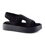 Sandalia de plataforma color negro con tiras de tela elástica adornadas con strass.