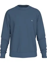 Buzo azul de felpa de algodón y poliéster, de la colección Calvin Klein Jeans. Tiene cuello redondo, manga larga, puños y dobladillo de punto canalé, ajuste regular e insignia con logo de Calvin Klein bordado en el pecho.