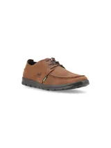 Zapato náutico casual de cuero azul marino con cordones, suela de goma color crema y plantilla calada.