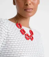 Blusa de manga larga abullonada, con cuello redondo y tejido de punto texturizado.