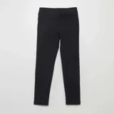 Legging negro liso con cintura elástica.