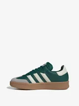 Zapatillas de gamuza verde con detalles en beige, diseño retro y forro interno de cuero, ideal para uso diario.