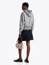 Buzo gris melange de Tommy Hilfiger con capucha y cordón ajustable. Logotipo bordado en el pecho y en la manga.