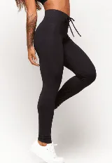 Calza negra de poliamida y elastano, con cintura alta y elástico interno.