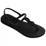 Sandalia tipo flip-flop negra con diseño de tiras cruzadas y suela de goma antideslizante.