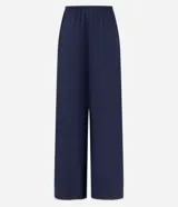 Pantalón de playa confeccionado en viscolino azul marino con lazo en la cintura y bies contrastante blanco en los laterales.