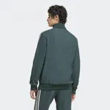 Campera Adidas de la Juventus, color verde oscuro con rayas blancas en las mangas. Tiene cierre frontal, cuello alto, bolsillos laterales y escudo de la Juventus bordado en el pecho.