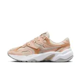 Championes Nike Al8 de mujer, color crema con detalles en naranja y logo plateado.