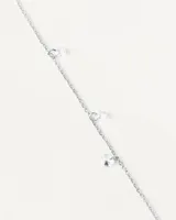 Pulsera de plata con circonitas redondas en diseño delicado.