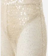 Pantalón femenino estilo pantalona de corte amplio, color beige claro, con superposición de lentejuelas y forro interior tipo bombacha cavada.