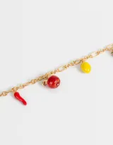 Pulsera dorada de cadena de eslabones con dijes esmaltados de frutas y verduras: choclo, ají, manzana roja, limón y hongo.